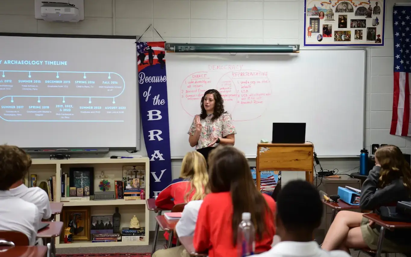 teacher in front of classon page image