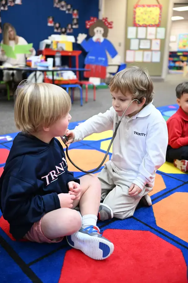 preschool kids playing with stetoscopeon page image