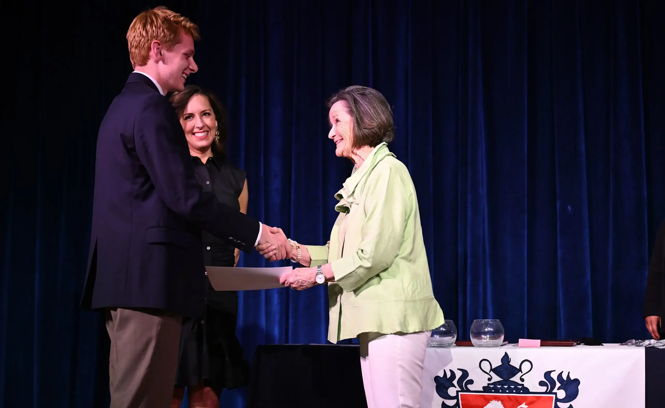 Teachers shaking hands at awards night