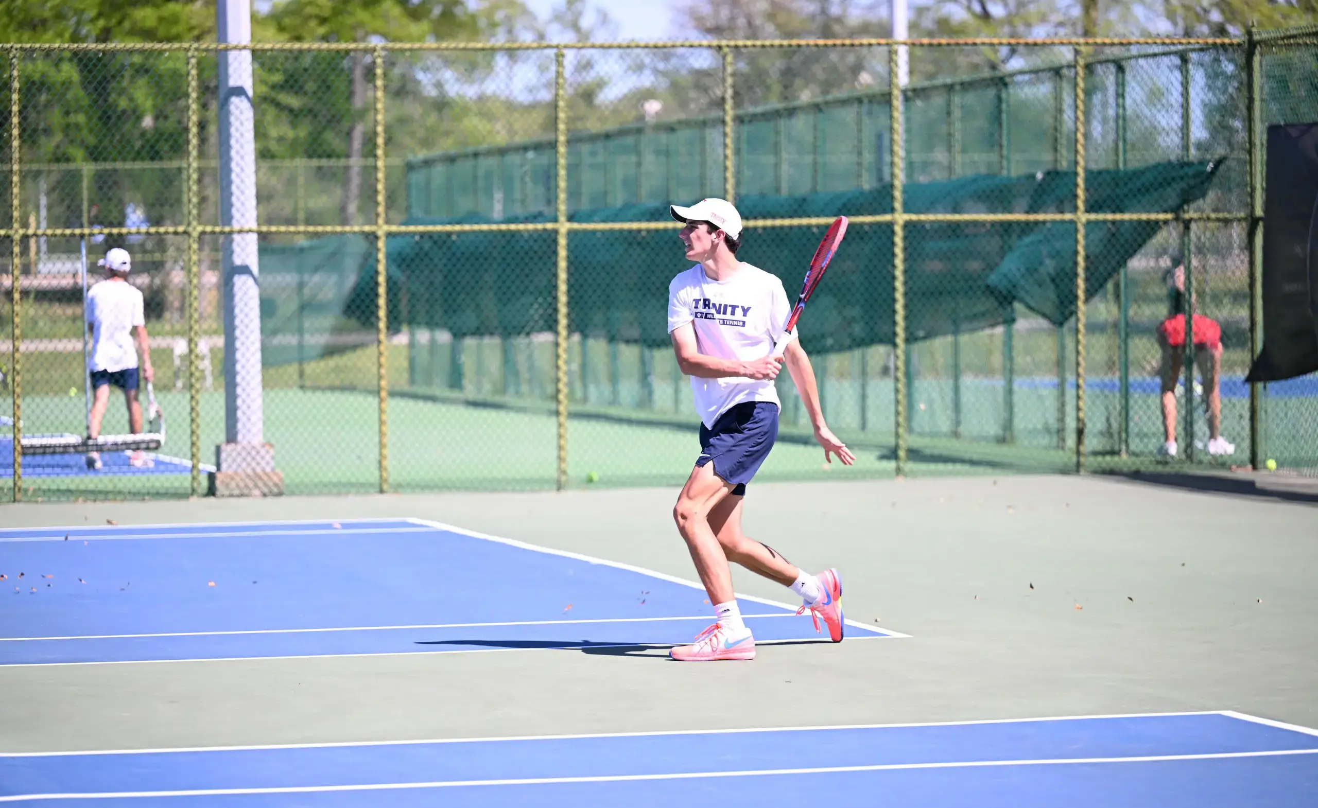 Student athlete playing tennis