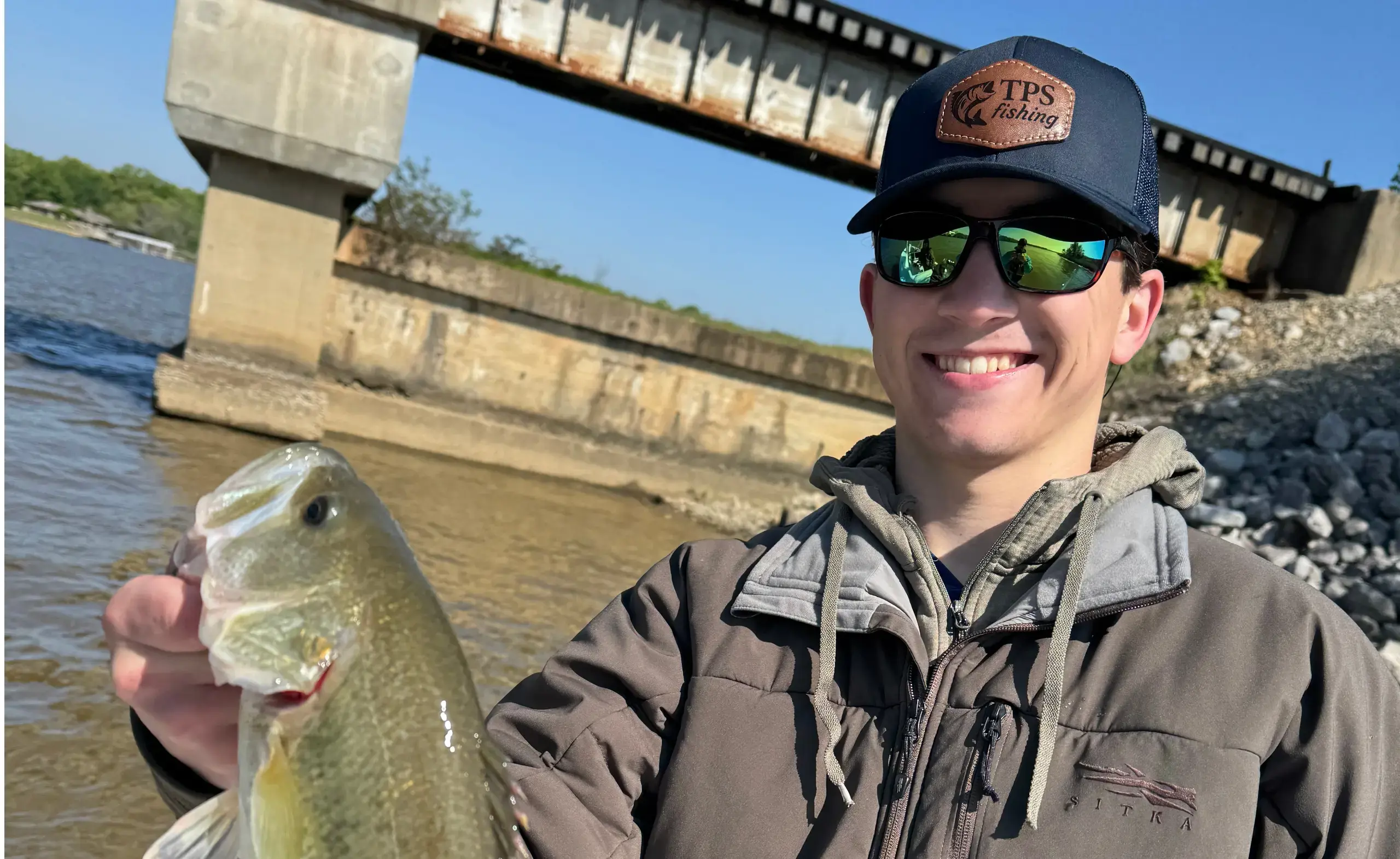 Fisher holding up a catch
