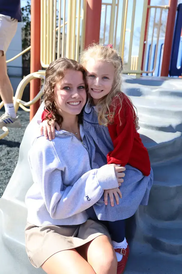 senior buddy and younger girl on page image