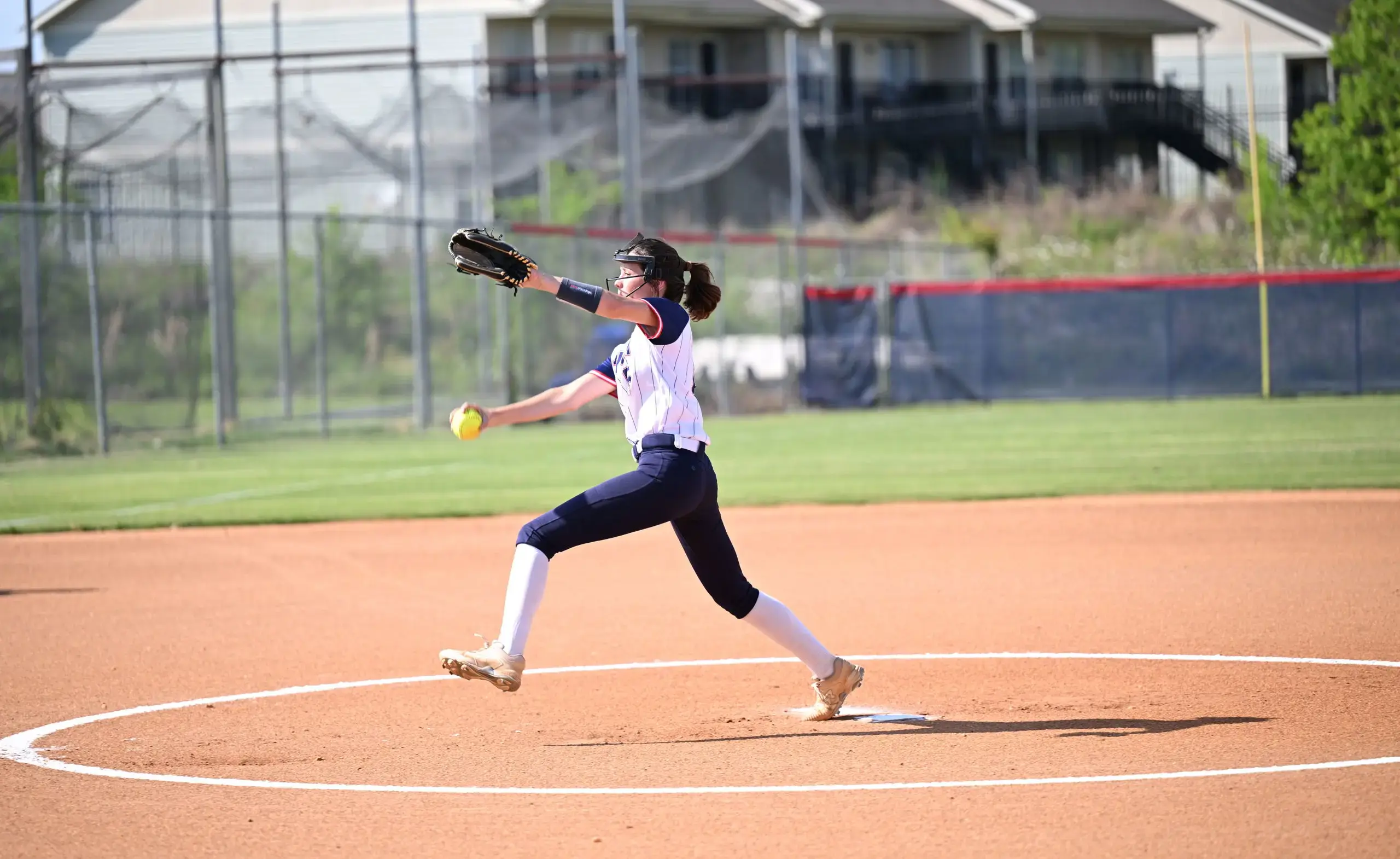 Athlete pitching softball