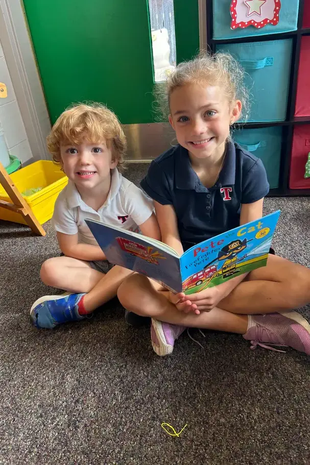 Kids reading togetheron page image
