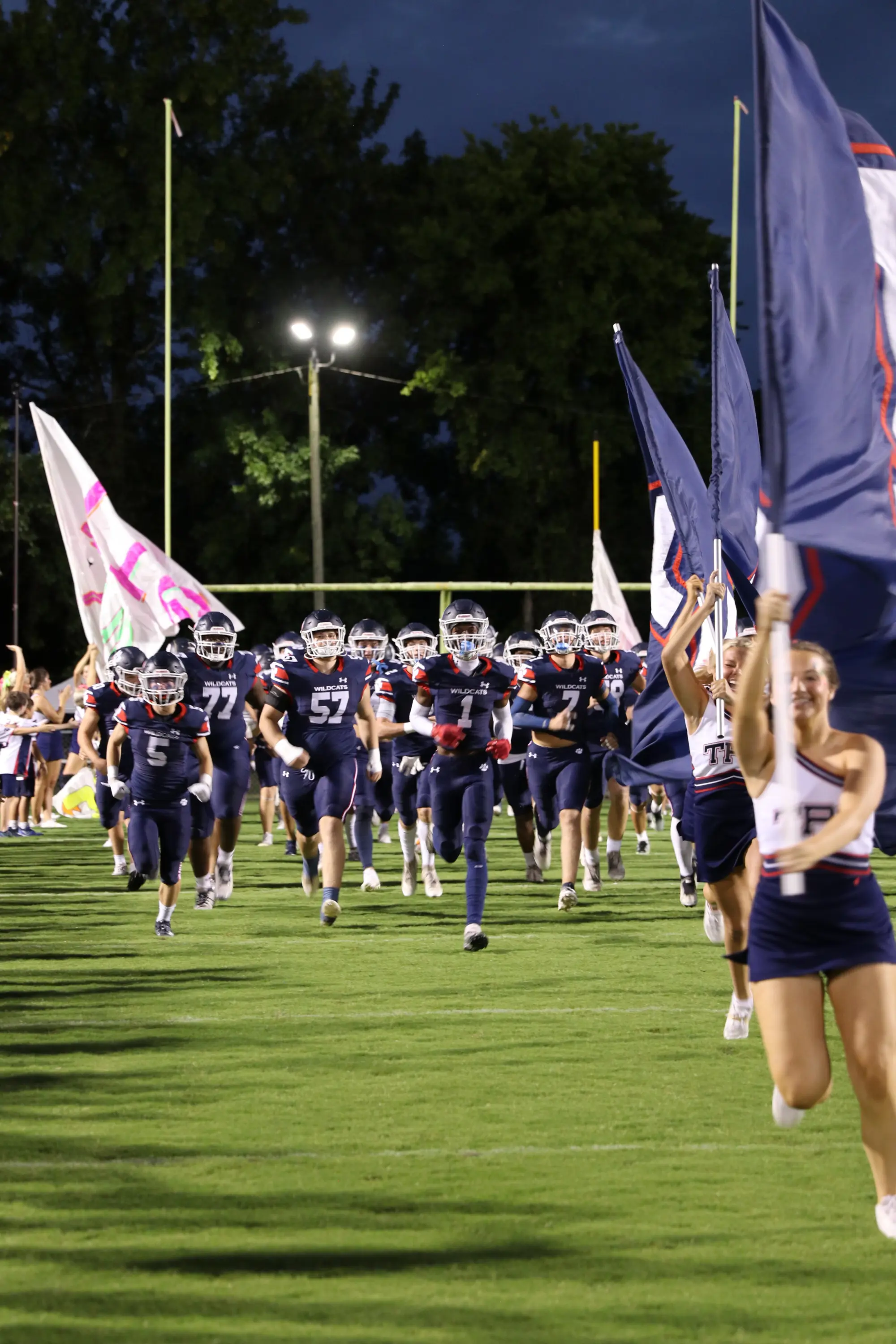 football running out of the tunnel